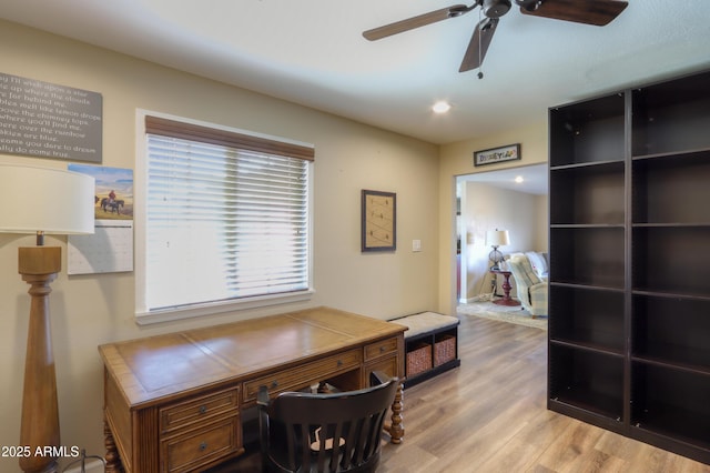 office area with ceiling fan and light wood-type flooring