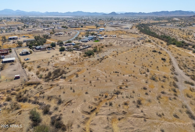 birds eye view of property featuring a mountain view