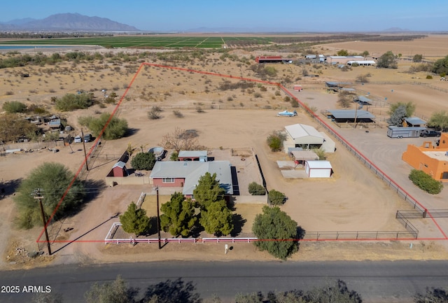 drone / aerial view with a rural view and a mountain view