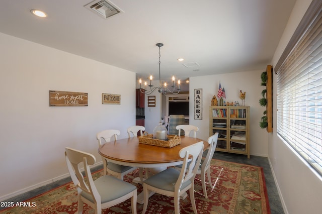 dining room with a notable chandelier