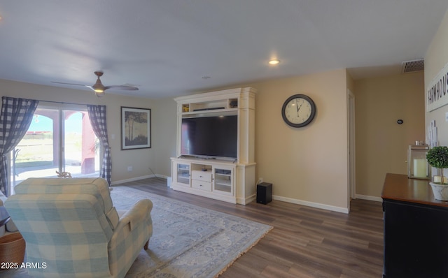 living room featuring hardwood / wood-style flooring and ceiling fan