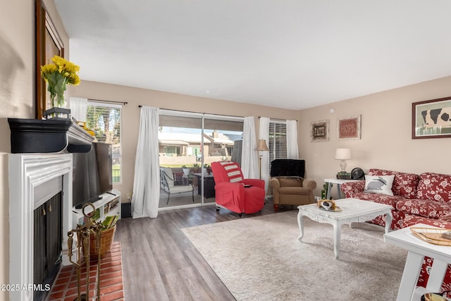 25225 S Glenburn Dr, Sun Lakes, AZ 85248 - living area with wood finished floors and a fireplace with flush hearth
