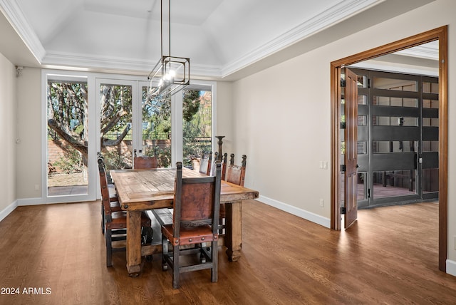 dining area featuring ornamental molding, baseboards, an inviting chandelier, and dark wood-style flooring