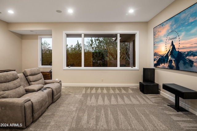 living area with recessed lighting, baseboards, and carpet floors