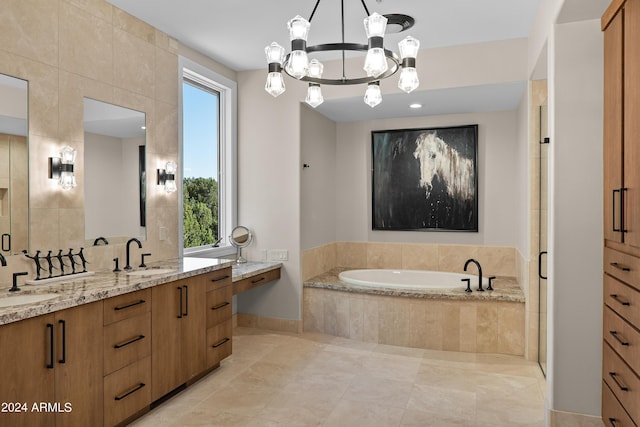 full bathroom with a sink, a bath, double vanity, and tile patterned flooring