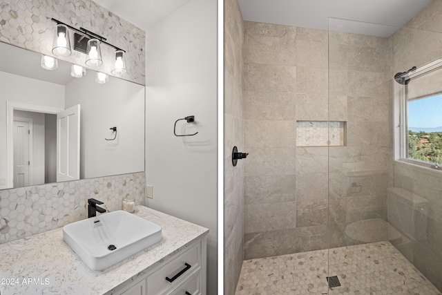 full bath featuring tasteful backsplash, vanity, and walk in shower