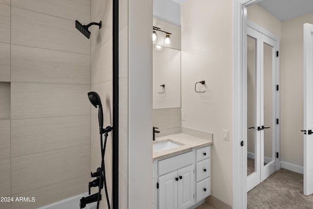 bathroom featuring vanity and a shower