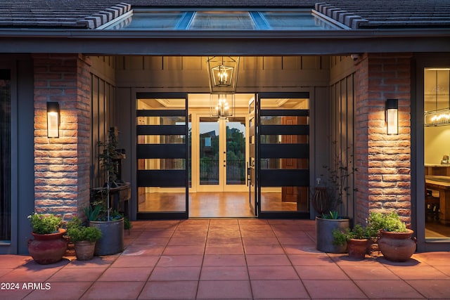 doorway to property with french doors and brick siding