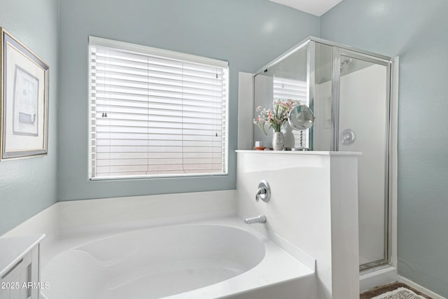 bathroom featuring plus walk in shower and vanity