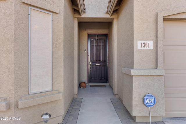 doorway to property featuring a garage