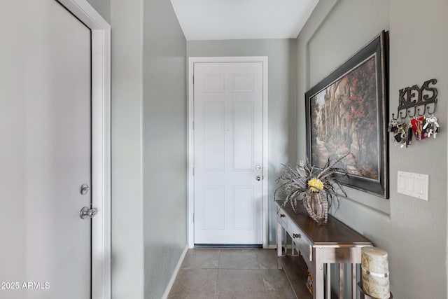 doorway with light tile patterned flooring