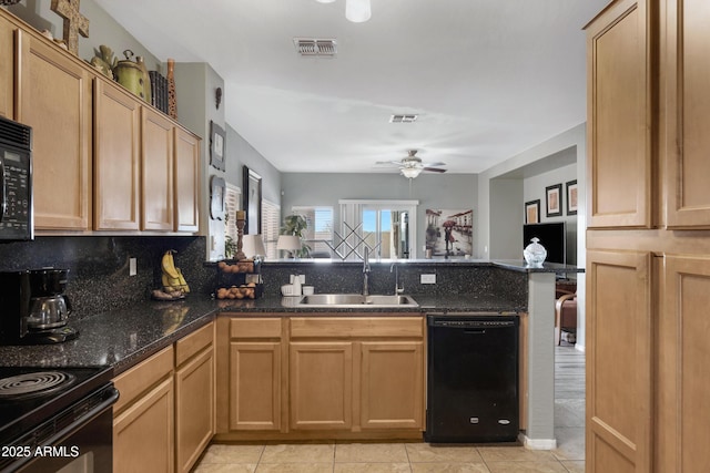 kitchen featuring black appliances, sink, light tile patterned floors, ceiling fan, and kitchen peninsula