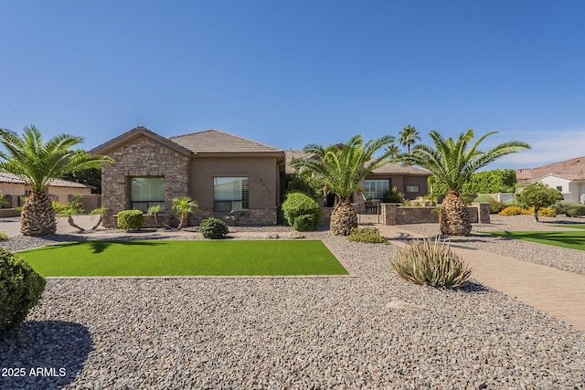 10033 W Jj Ranch Rd, Peoria, AZ 85383 - view of front facade with stone siding, a tiled roof, and stucco siding