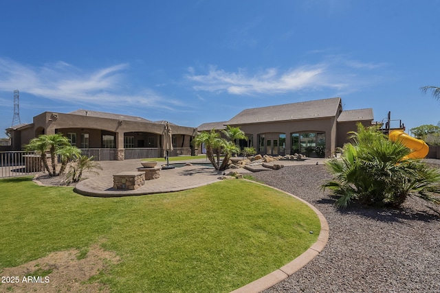 10033 W Jj Ranch Rd, Peoria, AZ 85383 - back of property with stucco siding and a patio