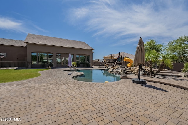 10033 W Jj Ranch Rd, Peoria, AZ 85383 - view of swimming pool featuring a patio area and a playground