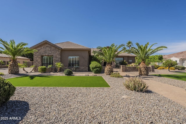 10033 W Jj Ranch Rd, Peoria, AZ 85383 - view of front of property with stone siding, a tile roof, and stucco siding