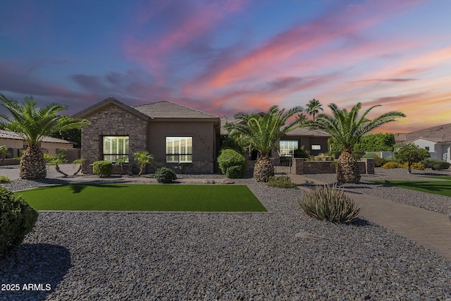 10033 W Jj Ranch Rd, Peoria, AZ 85383 - view of front facade with stone siding, a tile roof, and stucco siding