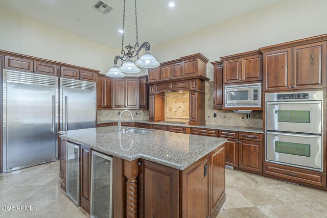 10033 W Jj Ranch Rd, Peoria, AZ 85383 - kitchen featuring built in appliances, a sink, wine cooler, decorative backsplash, and recessed lighting