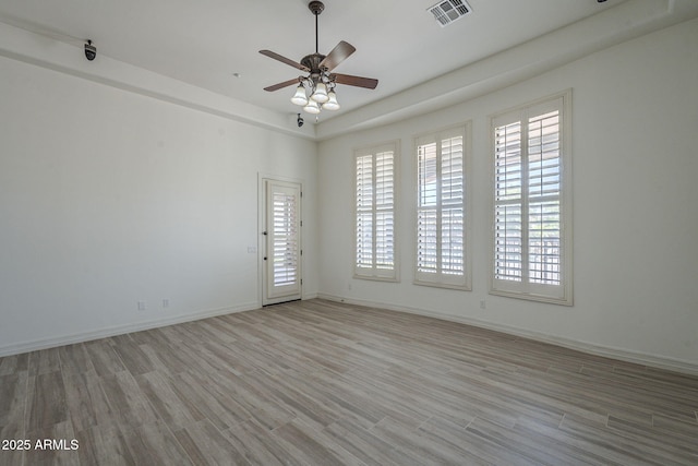 10033 W Jj Ranch Rd, Peoria, AZ 85383 - spare room with plenty of natural light, light wood finished floors, a ceiling fan, and baseboards