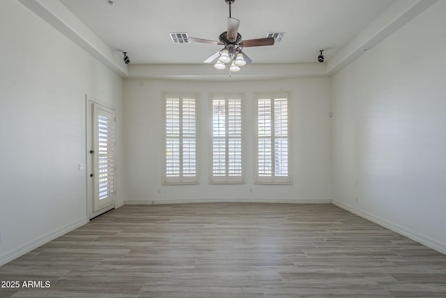 10033 W Jj Ranch Rd, Peoria, AZ 85383 - spare room featuring a ceiling fan, light wood-type flooring, and baseboards