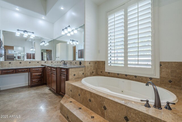 10033 W Jj Ranch Rd, Peoria, AZ 85383 - full bath with a jetted tub, vanity, a high ceiling, and tile patterned flooring
