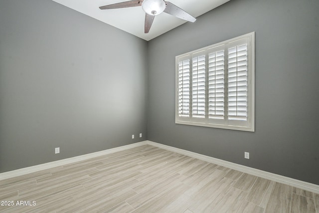 10033 W Jj Ranch Rd, Peoria, AZ 85383 - unfurnished room with ceiling fan, baseboards, and wood finished floors