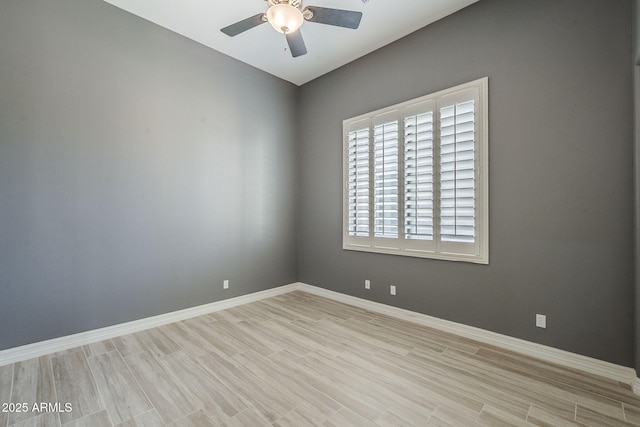 10033 W Jj Ranch Rd, Peoria, AZ 85383 - unfurnished room with ceiling fan, wood finished floors, and baseboards