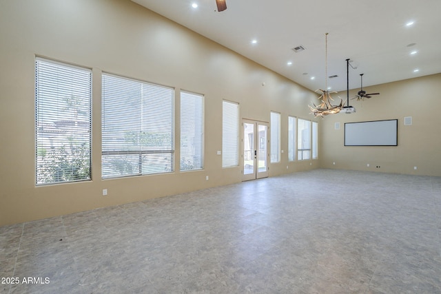 10033 W Jj Ranch Rd, Peoria, AZ 85383 - spare room with ceiling fan, healthy amount of natural light, a chandelier, recessed lighting, and a towering ceiling