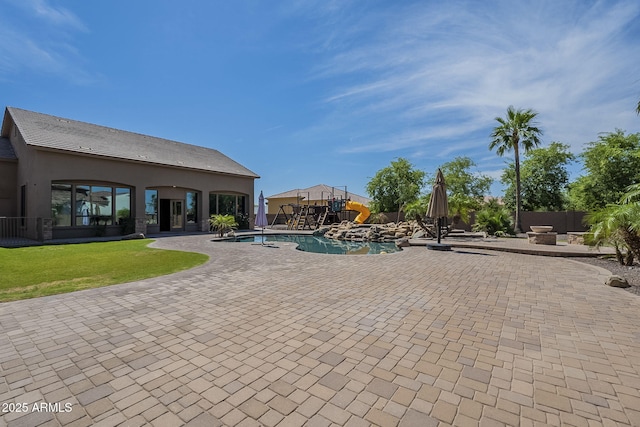 10033 W Jj Ranch Rd, Peoria, AZ 85383 - view of pool featuring a patio area and a fire pit