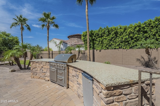 10033 W Jj Ranch Rd, Peoria, AZ 85383 - fenced backyard featuring a patio area