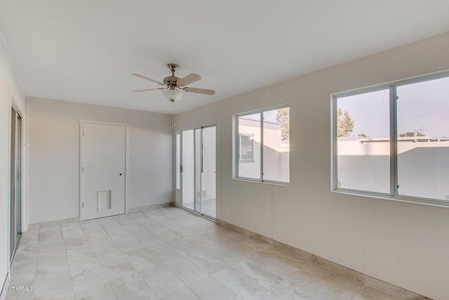 unfurnished bedroom featuring multiple closets and ceiling fan