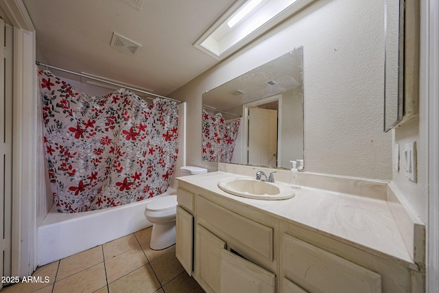 9021 W Mulberry Dr, Phoenix, AZ 85037 - bathroom with visible vents, vanity, toilet, tile patterned floors, and shower / bath combo