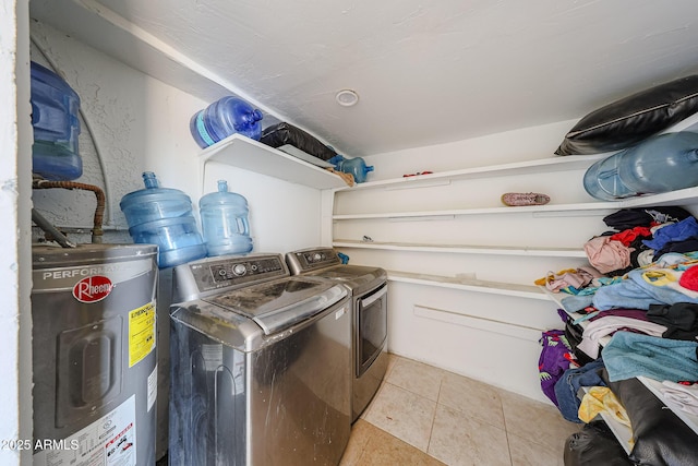 9021 W Mulberry Dr, Phoenix, AZ 85037 - laundry area with water heater, light tile patterned floors, and washing machine and clothes dryer