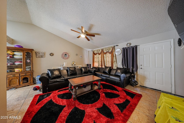9021 W Mulberry Dr, Phoenix, AZ 85037 - living room featuring a ceiling fan, a textured ceiling, light tile patterned floors, and vaulted ceiling