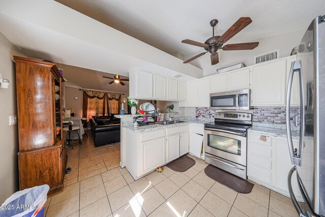 9021 W Mulberry Dr, Phoenix, AZ 85037 - kitchen with backsplash, stainless steel appliances, a ceiling fan, and a sink