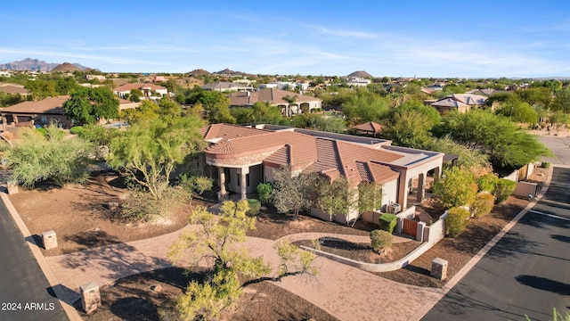 birds eye view of property with a mountain view