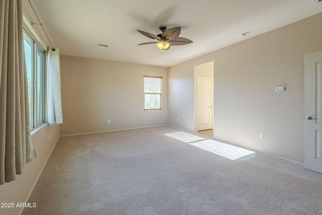 unfurnished room with light carpet and ceiling fan