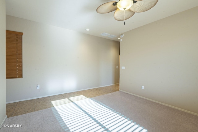 tiled empty room with ceiling fan