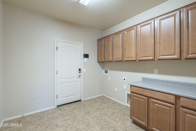 laundry area with cabinets, gas dryer hookup, electric dryer hookup, and washer hookup