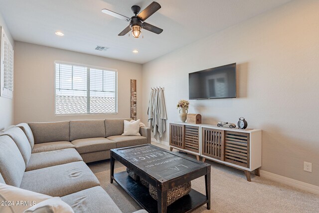 living room with an inviting chandelier and light hardwood / wood-style flooring