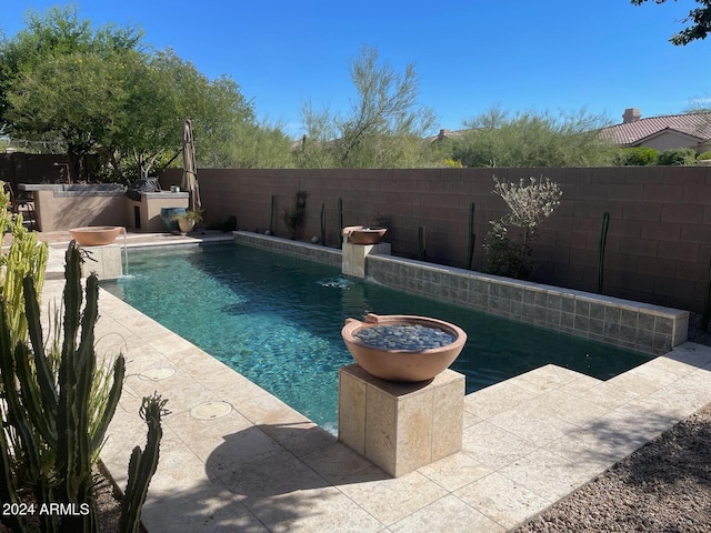 view of pool featuring a patio and pool water feature