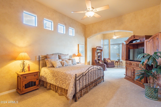 bedroom with light colored carpet and ceiling fan