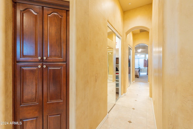 corridor featuring light tile patterned floors