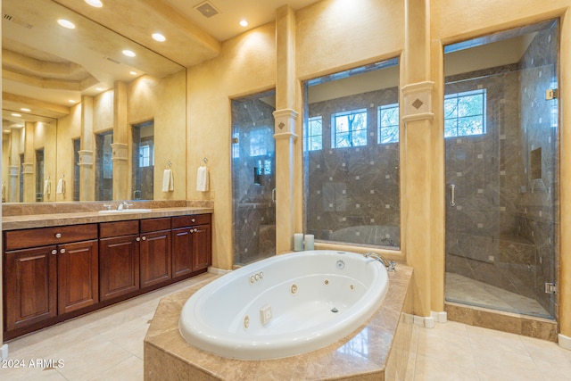 bathroom featuring vanity, tile patterned floors, and shower with separate bathtub