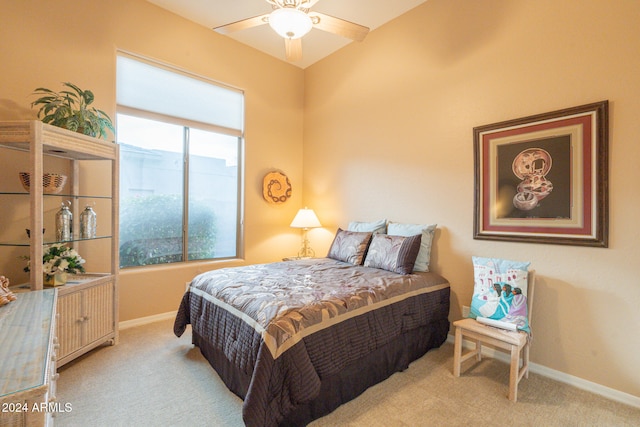 bedroom with light carpet and ceiling fan