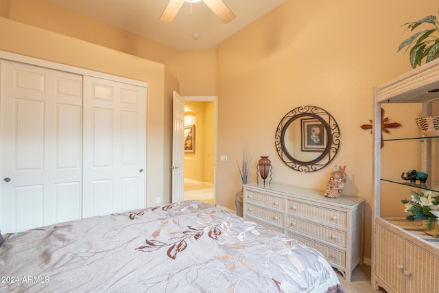 bedroom with light carpet, a closet, and ceiling fan