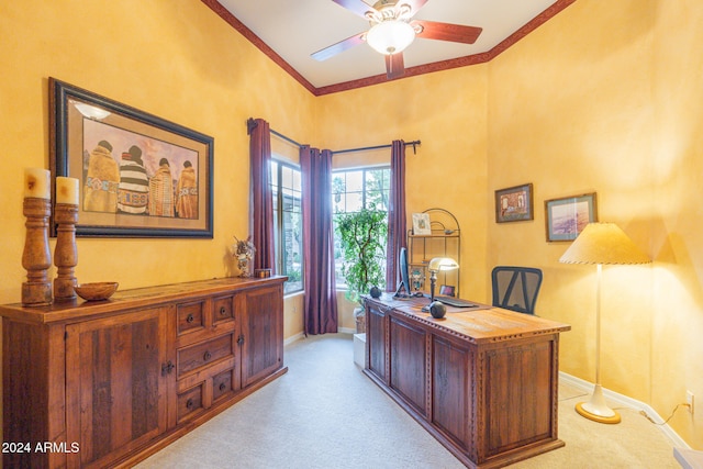 carpeted home office with ornamental molding and ceiling fan