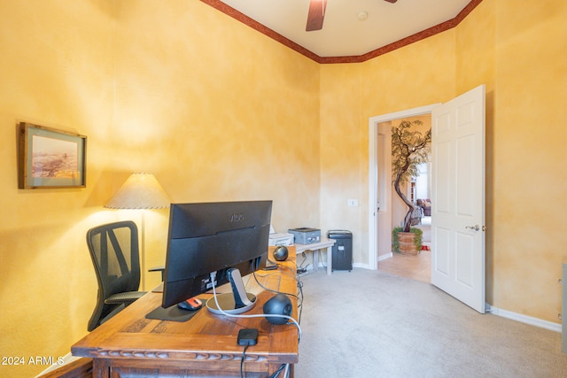 carpeted home office with crown molding and ceiling fan