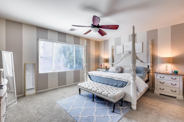 bedroom featuring ceiling fan and carpet