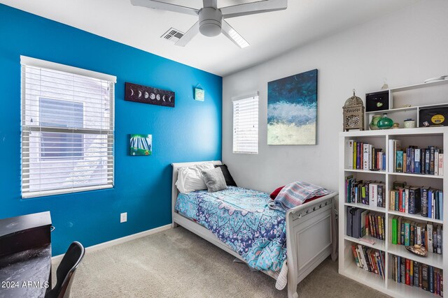 carpeted bedroom with ceiling fan